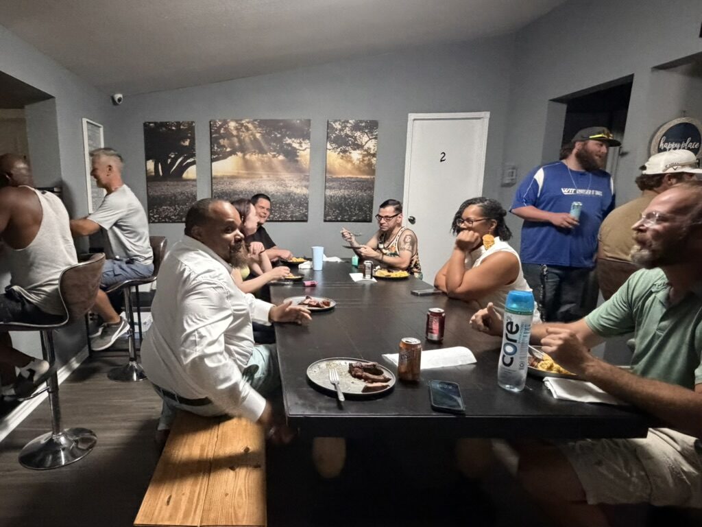 Group dinner at Revive Recovery Homes — community meal